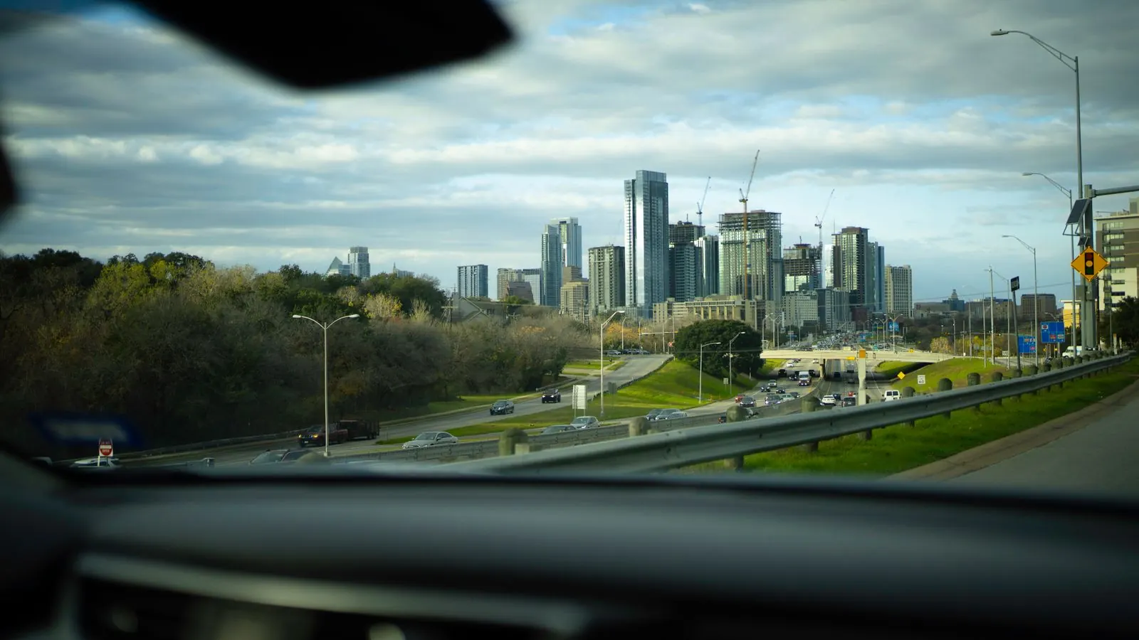Austin skyline seen through a car windshield from the highway