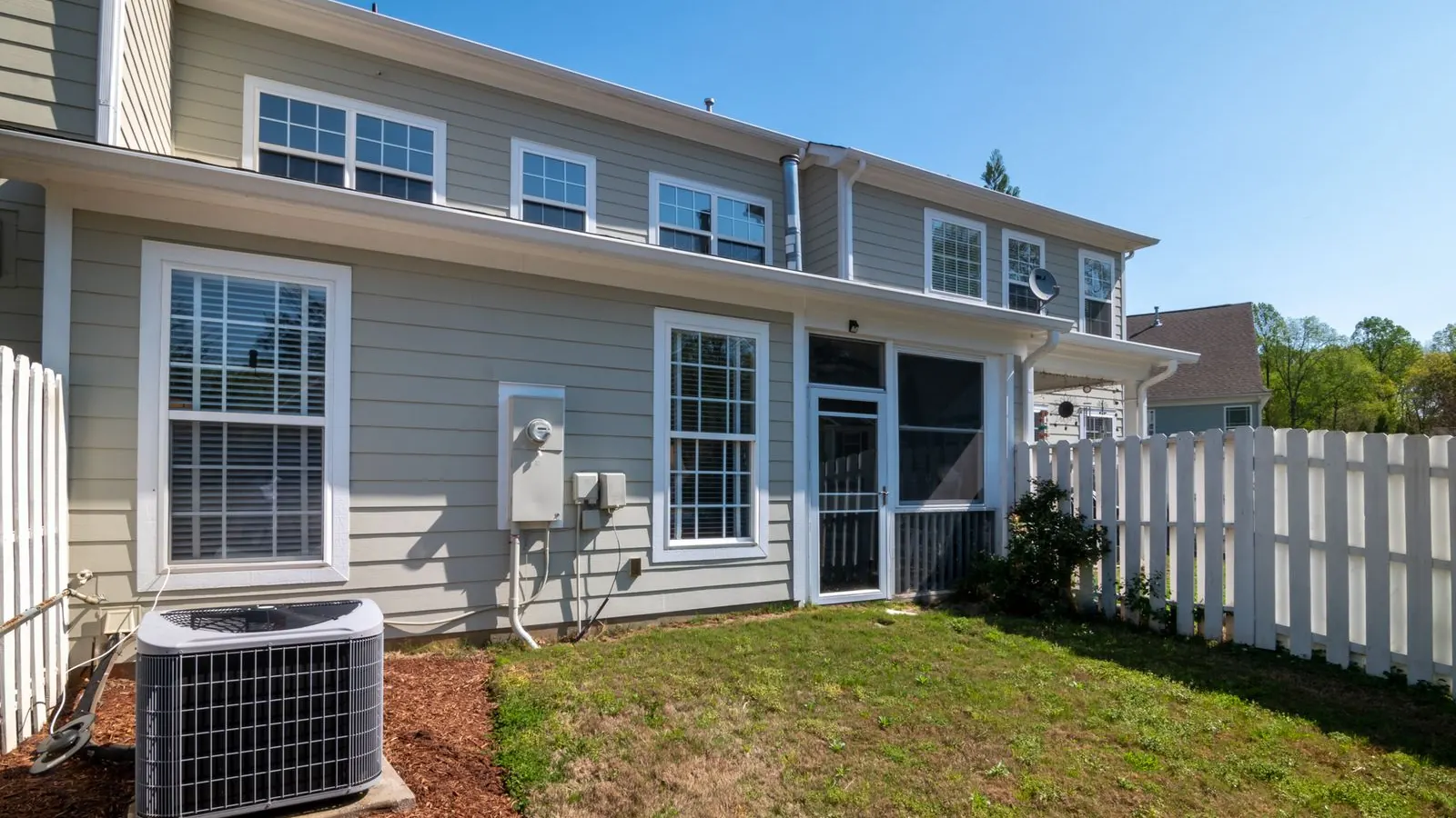 Air conditioning unit beside a suburban house