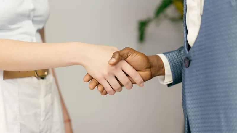 Close-up of a handshake after a job
