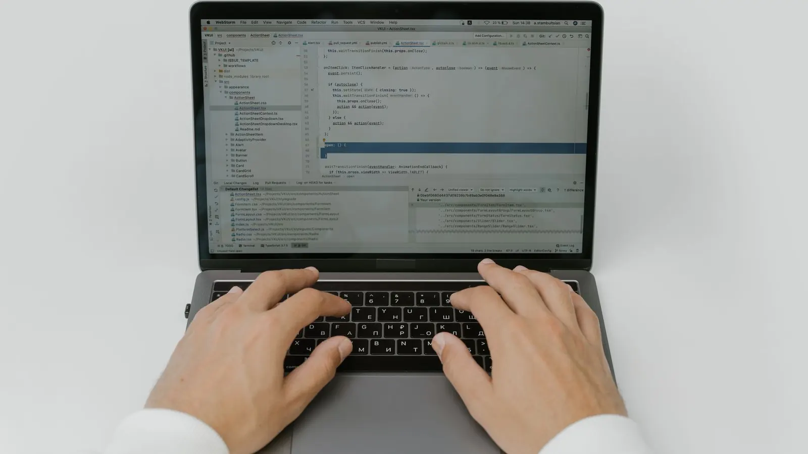 Hands typing on a laptop while planning a small business website and its cost