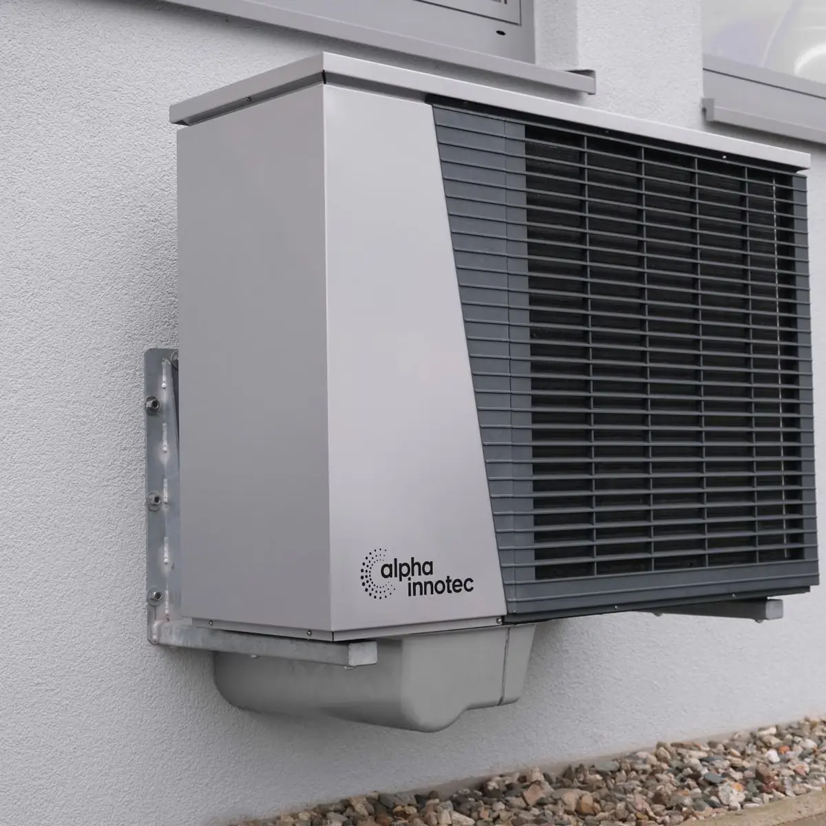 A high-efficiency heat pump mounted on the exterior wall of a home